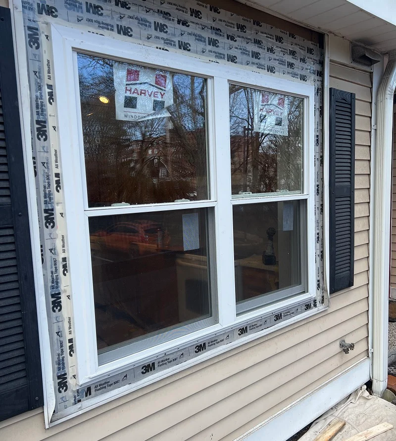 A new construction Harvey window properly flashed with 3M all weather flashing tape